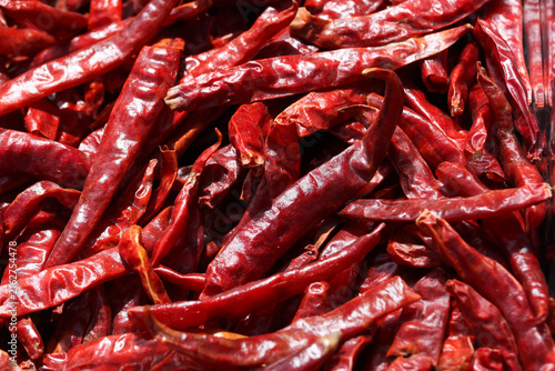 Cuadro en lienzo Dried red chili pepper closeup showing wrinkled texture and spicy culinary ingre