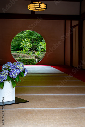 flowers on the windowsill round window japan