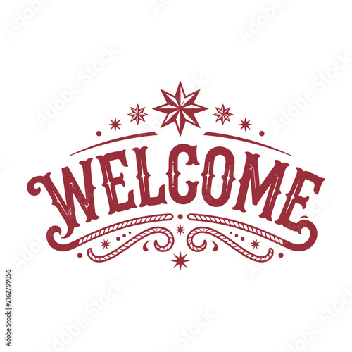 Vintage welcome sign with ornate red and gold holiday lettering and decorative stars and swirls