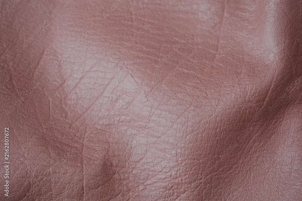 Fototapeta premium Abstract detailed close up of crumpled textured reddish brown synthetic leather fabric material background