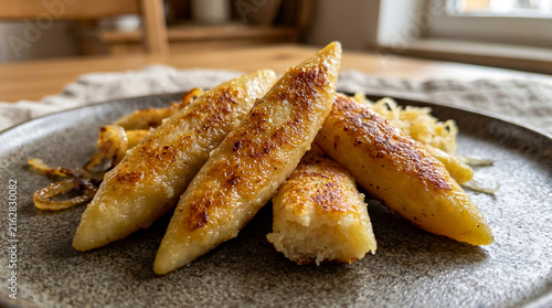 Delicious Golden Brown Fried Plantains Served on a Ceramic Plate for a Tasty Snack