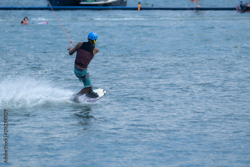 Wakeboarder Riding Through Water with Dynamic Splash