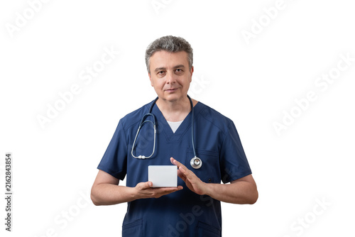 A middle-aged male doctor is holding a medicine box with a space for text.