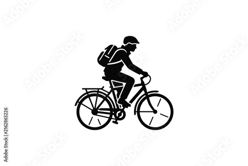 Silhouette of a person riding a bicycle with a backpack.