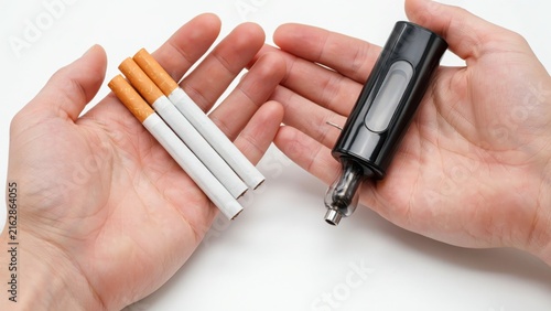 Cigarettes and vape mod in hands
