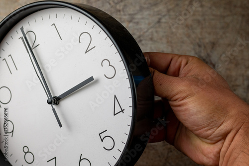 Photography Adjusting a Wall Clock for Daylight Saving Time