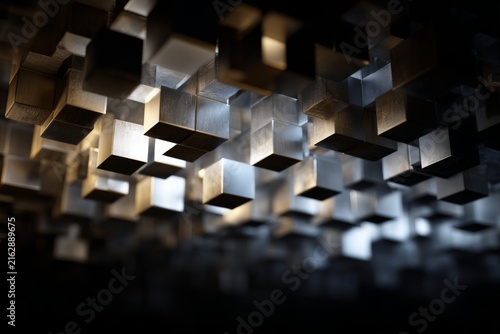 Abstract geometric structure made of floating metallic cubes in a dark space, showcasing modern design and artistic innovation