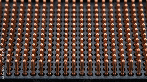 Close up of a computer processor with many pins.
