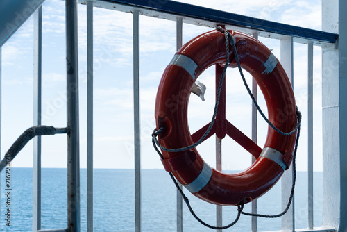 Photography Life buoy on railing overlooking the sea