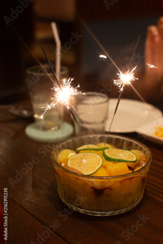 Sparkling Sparklers on a Fruit Dessert for a Speci
