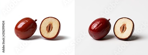 Whole and halved jujube fruit on a white background, studio shot.