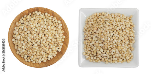 Bild auf Leinwand Sorghum seeds in wooden and ceramic bowl isolated on white background