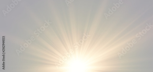 Vibrant golden sunrise sunburst and warm morning light rays isolated on grey background
