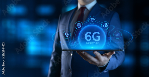Businessman Holding tablet with 6G Network Icons on Screen. Business and Technology concept