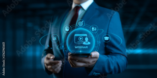 Businessman Holding Smartphone with Webinar Icons on Screen. E-learning and Education Concept