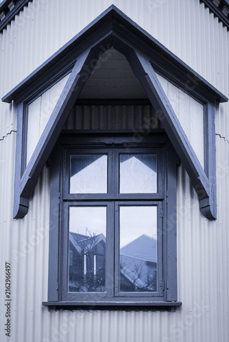 Traditional gabled window detail on corrugated building in Reykjavik Iceland