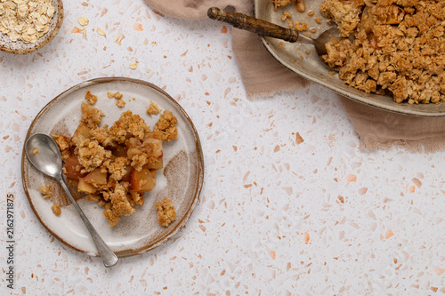 Obraz na plátně Serving of apple oat crumble dessert on plate