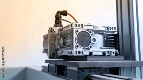 Fotografie Industrial gear motor with fins on aluminum casing for automation technology