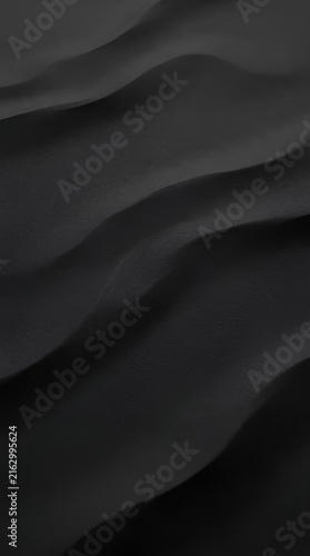 Elegant black wavy fabric texture with dramatic shadows and smooth ripples.