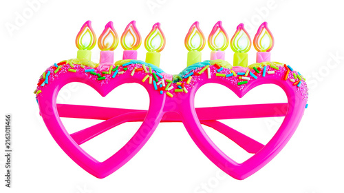 Obraz na plátně Pink heart-shaped novelty glasses with birthday candles and sprinkles