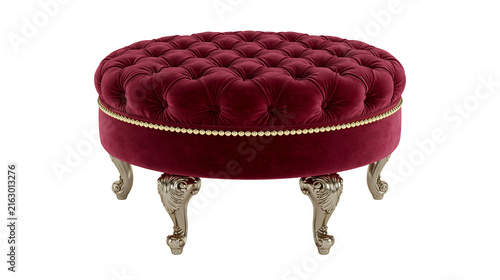 Round tufted velvet ottoman with ornate carved legs