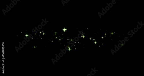 Glowing green star sparkles and magic dust floating on black background stars light effect shining