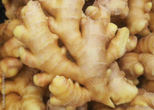 Fresh ginger roots as background	