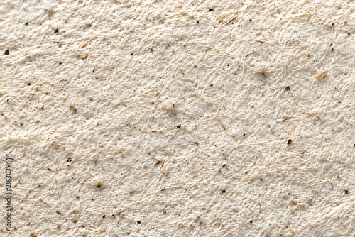 Close-up of small green moss growing on concrete surface
