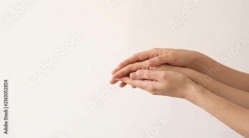 Minimalist International Charity Day concept showing two hands reaching toward each other, representing compassion, charity, generosity, equality, support and human connection.