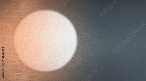 Abstract Minimalist Sphere Glowing With Peach And White Light On Dark Textured Surface Background