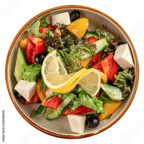 Greek salad with feta cheese and lemon isolated