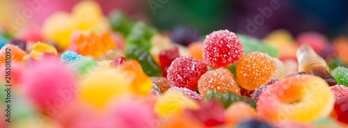 Fototapeta Assorted colorful gummy candies texture mix bright sweet treat variety.
