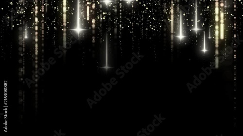 Light particles drop down on a black background.