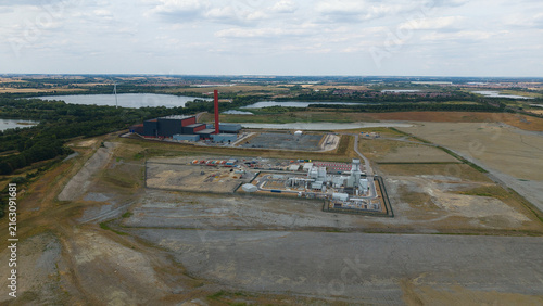 Aerial view of Rookery South ERF and Millbrook Power Plant situated in a vast industrial landscape with surrounding lakes and fields in Stewartby, England, United Kingdom.