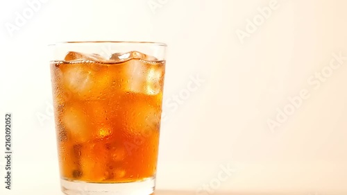 Refreshing Iced Tea in a Clear Glass with Ice Cubes.