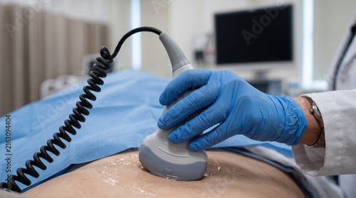 Healthcare professional performing an abdominal ultrasound scan on a patient in a modern medical clinic