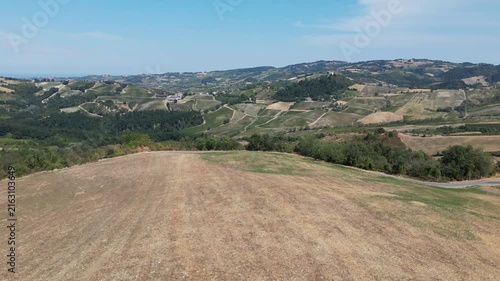 Europe, Italy, Lombardy, Pavia, Montù Berchielli – drone view of the Oltrepò Pavese hills; drought and water shortages lead to an early grape harvest for wine production. Global warming and climate ch