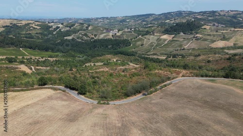 Europe, Italy, Lombardy, Pavia, Montù Berchielli – drone view of the Oltrepò Pavese hills; drought and water shortages lead to an early grape harvest for wine production. Global warming and climate ch