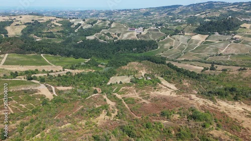 Europe, Italy, Lombardy, Pavia, Montù Berchielli – drone view of the Oltrepò Pavese hills; drought and water shortages lead to an early grape harvest for wine production. Global warming and climate ch