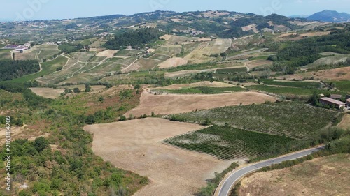 Europe, Italy, Lombardy, Pavia, Montù Berchielli – drone view of the Oltrepò Pavese hills; drought and water shortages lead to an early grape harvest for wine production. Global warming and climate ch