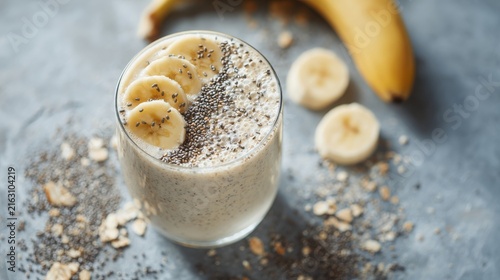 Creamy Banana Smoothie with Chia Seeds and Oats on Gray Background