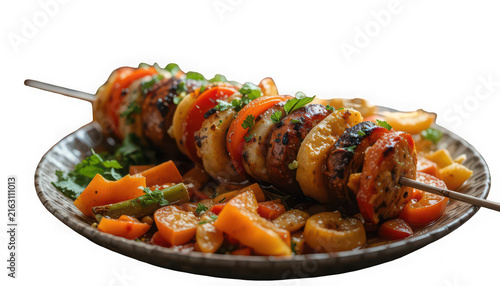 Grilled chicken skewer with roasted vegetables on a plate isolated on transparent background