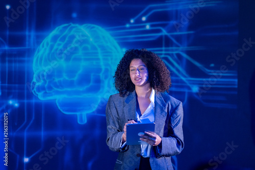 Canvas Print Speaker presents on technology and innovation at a conference during the day