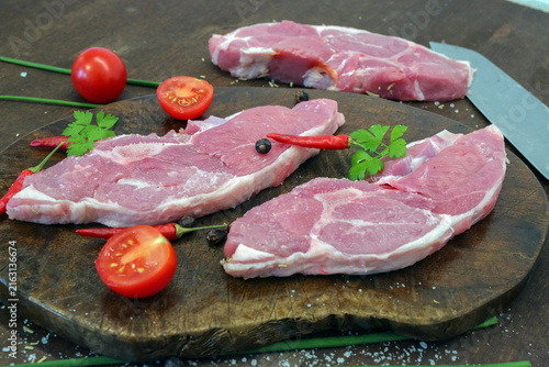 Lamb steak on the wooden plate