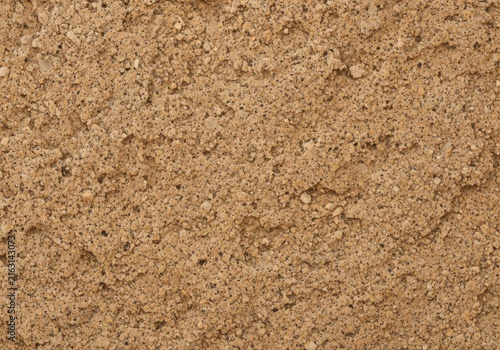 Close up texture of rough brown granite stone surface