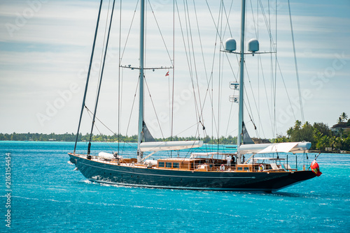 Bild auf Leinwand Modern Classic Sailing Superyacht motoring inside the lagoon in Bora Bora, Frenc