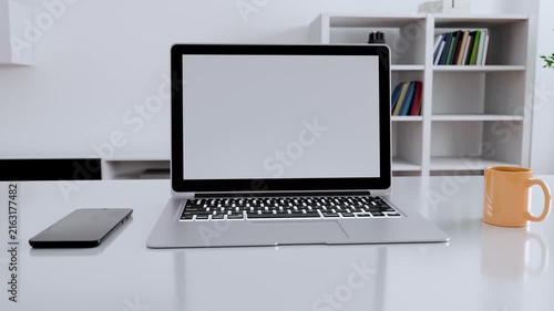 Modern minimalist workspace with laptop and coffee