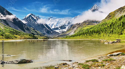 Mount Belukha the highest peak of Siberia part of the Katun range in Altai mountains and Akkem Lake on foreground