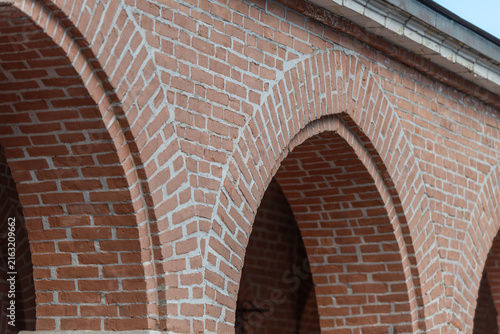 Photography Exploring the beauty of brick archways at a historic building during golden hour