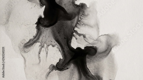 Black ink splatter abstract texture on white paper for creative design backgrounds